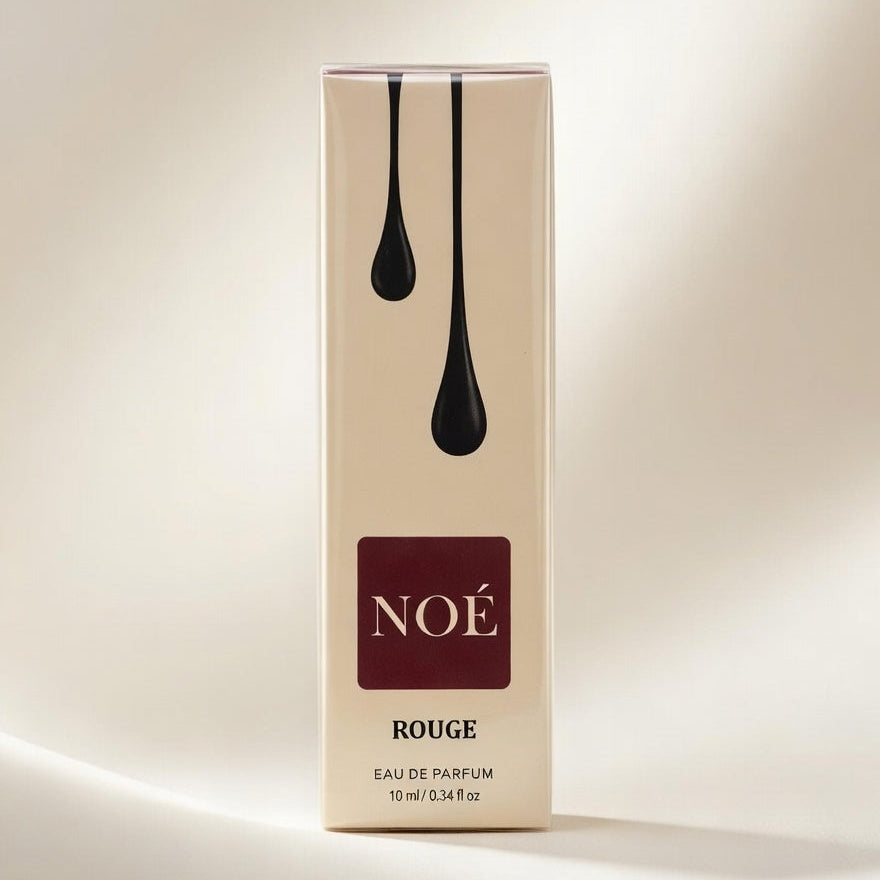Noé Rouge perfume box on a beige background