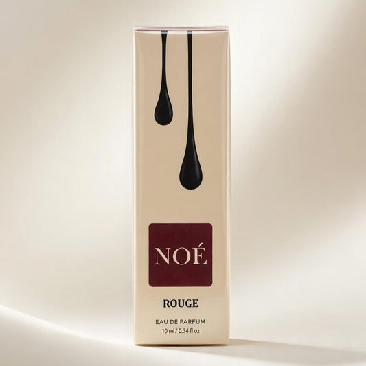 Noé Rouge perfume box on a beige background