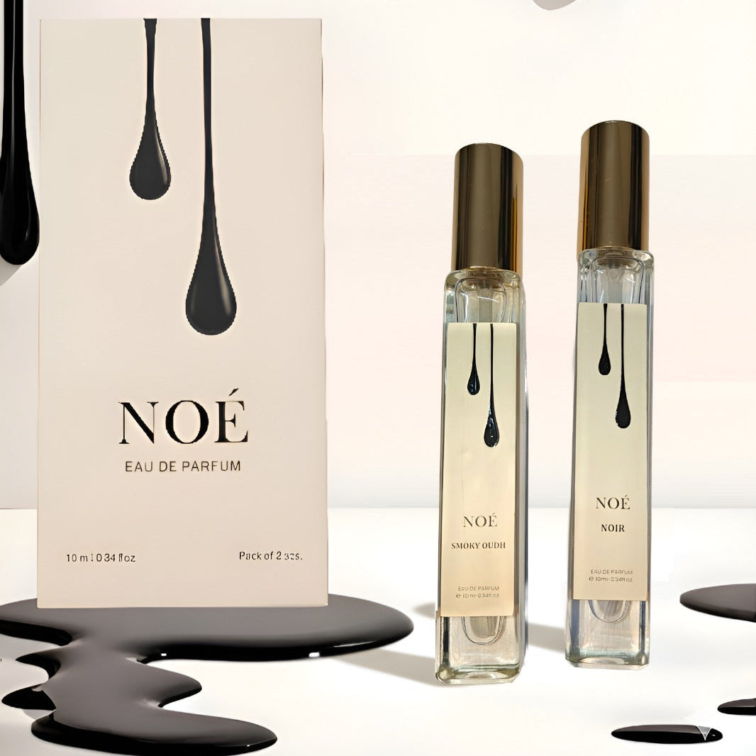 NOÉ Eau de Parfum boxed set with two 10ml bottles labeled Smoky Oudh and Noir, elegant black paint drip design