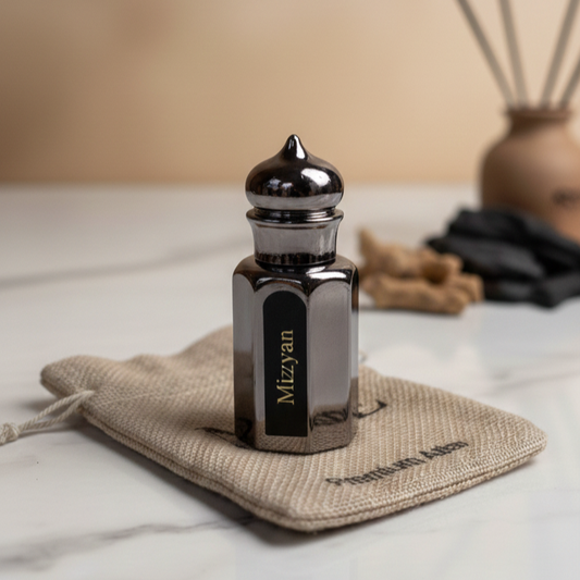 Mizyan black glass perfume bottle on beige pouch with blurred decorative background